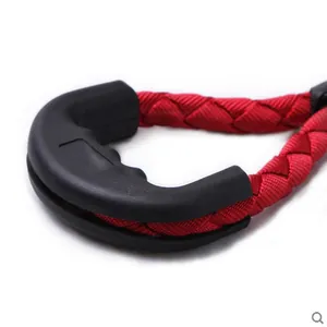 Durable red braided dog leash featuring an ergonomic black rubber handle for comfort