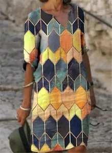 Detail view of colorful geometric diamond pattern on V-neck vintage dress