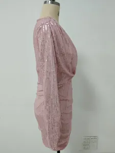Side profile detail of elegant pink sequined pleated evening dress on studio mannequin