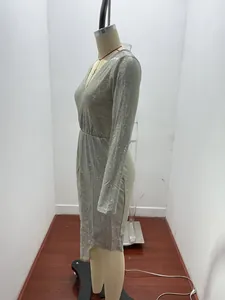 Side view detail of sparkling silver glitter long-sleeve V-neck evening dress for women