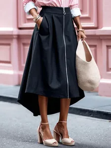 Elegant black high-waisted skirt featuring a front zipper and stylish irregular high-low hem
