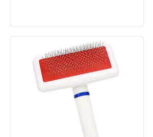 Close-up view of a professional pet slicker brush with protective white-tipped pins