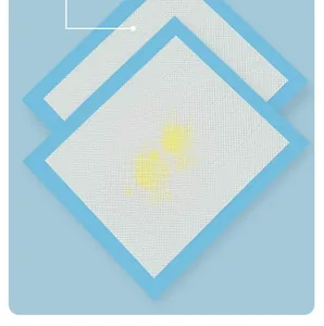 Detail view of thick absorbent pet training pads featuring a diamond texture surface