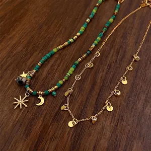 Set di collane vintage con perline e ciondolo luna e catenina d'oro con dischetti