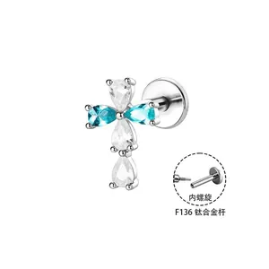 Premium F136 titanium legering kruis labret piercing met blauwe en heldere stenen