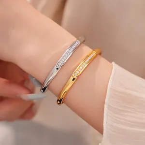 Elegant 18K gold plated oval CZ bangles for a luxurious minimalist look on the wrist