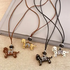 Charming polka dot puppy pendant necklaces with silver bow details on durable leather cords