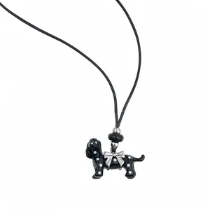 Black polka dot dog necklace with silver bow and leather cord pendant