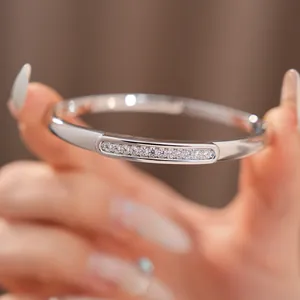 Elegant 18K white gold plated oval bangle featuring sparkling micro-pave zircons.