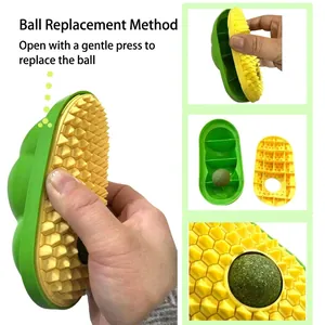 Detailed view showing how to open the pea cat self-groomer to replace the catnip ball.
