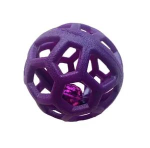 Close-up detail of a purple hollow TPR pet toy ball with an internal metallic bell