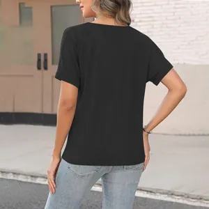 Detailed back view of a women's black short sleeve T-shirt showing its relaxed loose fit