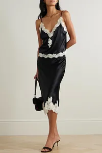 Detailed view of black satin cami and skirt set with delicate white lace trim