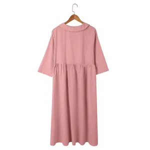 Detailed back view of a pink cotton linen midi dress featuring Peter Pan collar and sleeves