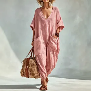 Loose V-neck pink linen jumpsuit with oversized pockets for summer beach vacations