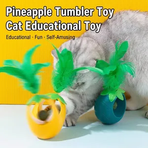 Pineapple-shaped interactive cat tumbler toy with catnip and vibrant green feathers