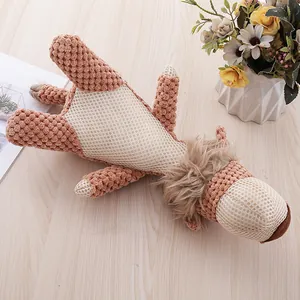 Close-up of plush dog chew toy featuring textured corn fleece and mesh fabric details