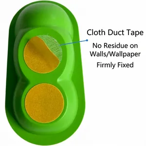 Pea-shaped cat massager with strong cloth-based adhesive for residue-free mounting