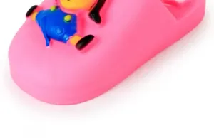 Close-up detail of a pink squeaky dog slipper toy featuring a cute cartoon character motif