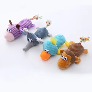 Set of four colorful corduroy animal pet toys with durable rope tails for dog play.