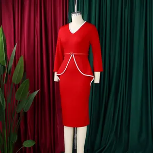 Detail view of a red professional pencil dress with white peplum trim and V-neckline