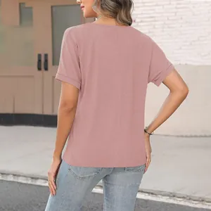 Back view of women's loose dusty pink short sleeve T-shirt with vertical seam detail