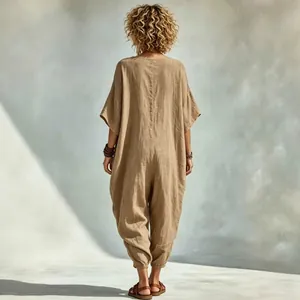 Oversized khaki linen-style jumpsuit for women shown from the back, ideal for summer beach