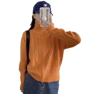 Stylish orange cable-knit turtleneck cardigan with a double-zipper closure for women