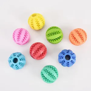 Collection of seven colorful dog chew balls designed for teeth cleaning and puppy play