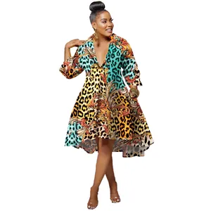 Detailed view of the vibrant leopard and baroque print on a slim deep V-neck dress.