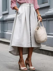 Elegant beige high-low midi skirt featuring a front zipper closure and side pockets