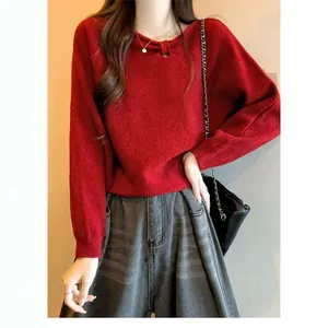 Elegant red knit sweater featuring a stylish diagonal neckline and soft batwing sleeves.