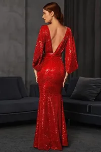 Back view of elegant red sequined evening gown with deep V-neck and long sleeves