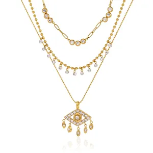 Elegante collar dorado de capas con ojo turco y colgantes de borla de circón