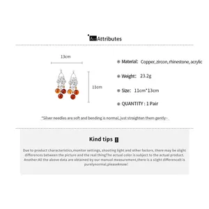 Graphique détaillé des attributs de matière et de taille pour ces boucles d'oreilles