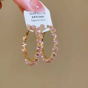 Elegant gold hoop earrings with pink zircons and 925 silver needle for daily wear