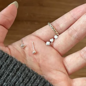 Minimalist silver geometric stud earrings set featuring heart, round and square shapes