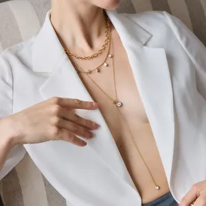 Detailed close-up of an 18k gold plated stainless steel Y-shaped necklace with zircon pendants