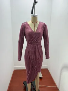 Detail of sparkling V-neck long sleeve evening dress in rose pink with wrap skirt.