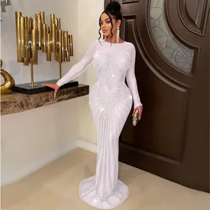Exquisite detail of white long sleeve evening gown with radiating rhinestone pattern