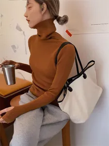 Elegant burnt orange ribbed turtleneck sweater for women, slim fit long sleeve knit