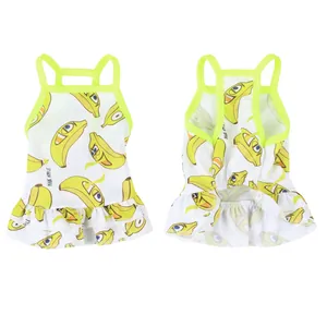 Detail view of pet summer dress with cute banana patterns and ruffled hem design