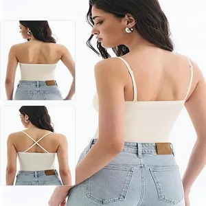 Close-up of white padded camisole showing three versatile strap styling options.