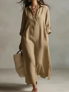 Khaki linen dress detail showing the lapel collar and natural fabric texture on a model