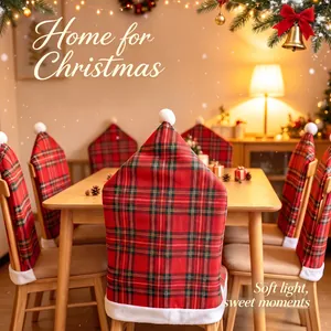 Festive red plaid Christmas chair covers with Santa hat pom-poms shown in a warm dining room