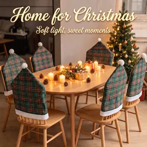Cozy plaid Christmas chair covers with white pom-poms in a warm dining room setting