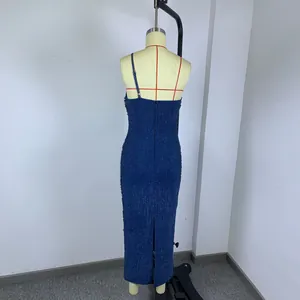 Back view of a shimmering blue knit bandage evening dress with a slim fit one-shoulder cut