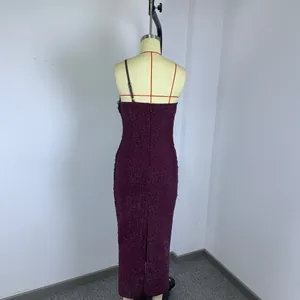 Detailed back view of a shimmering purple high stretch knit bandage dress on a mannequin