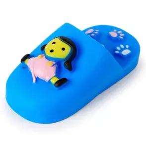 Detailed close-up view of a blue slipper-shaped squeaky dog toy featuring a cartoon girl