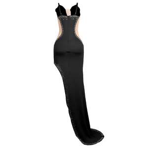 Close-up of sexy black evening gown with see-through mesh and sparkling rhinestones
